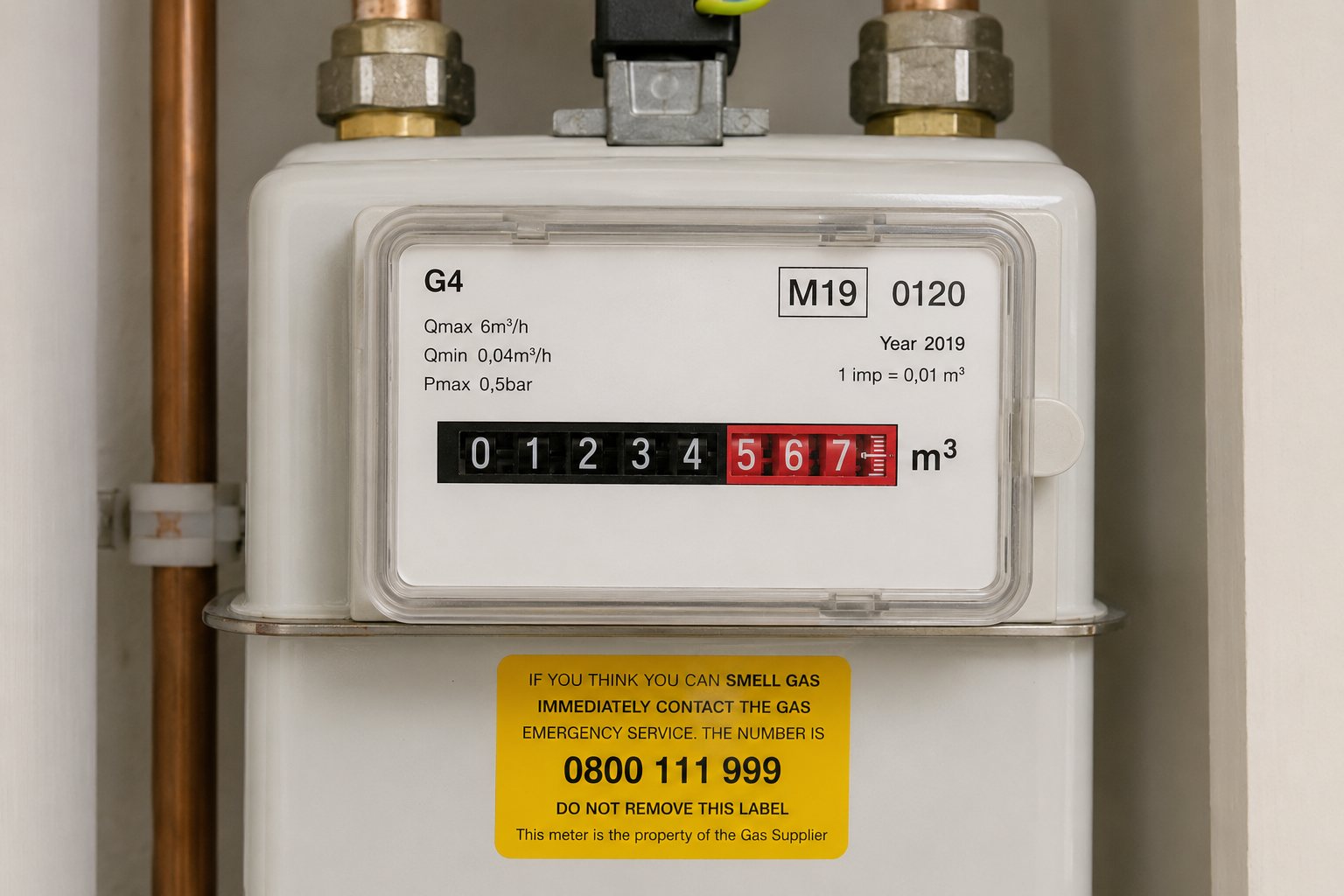 Domestic gas meter with emergency contact label