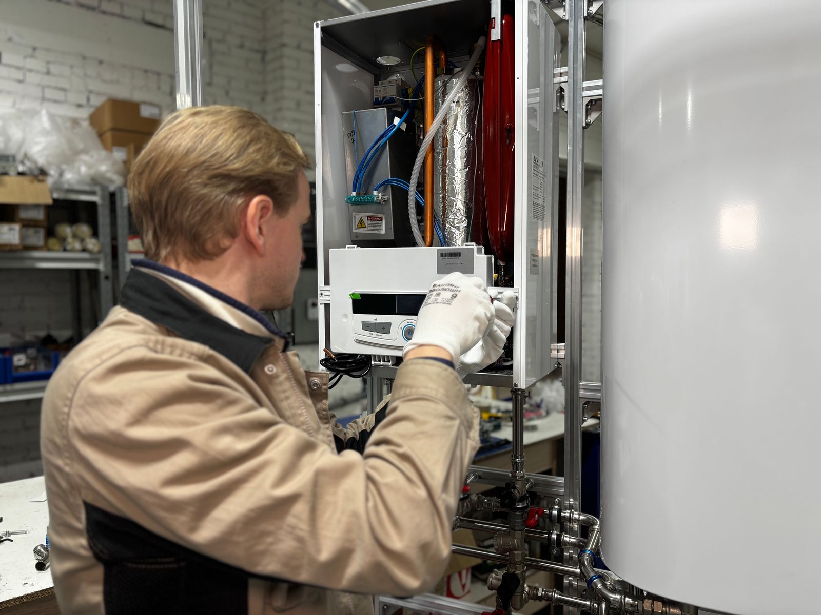 Engineer servicing a domestic boiler