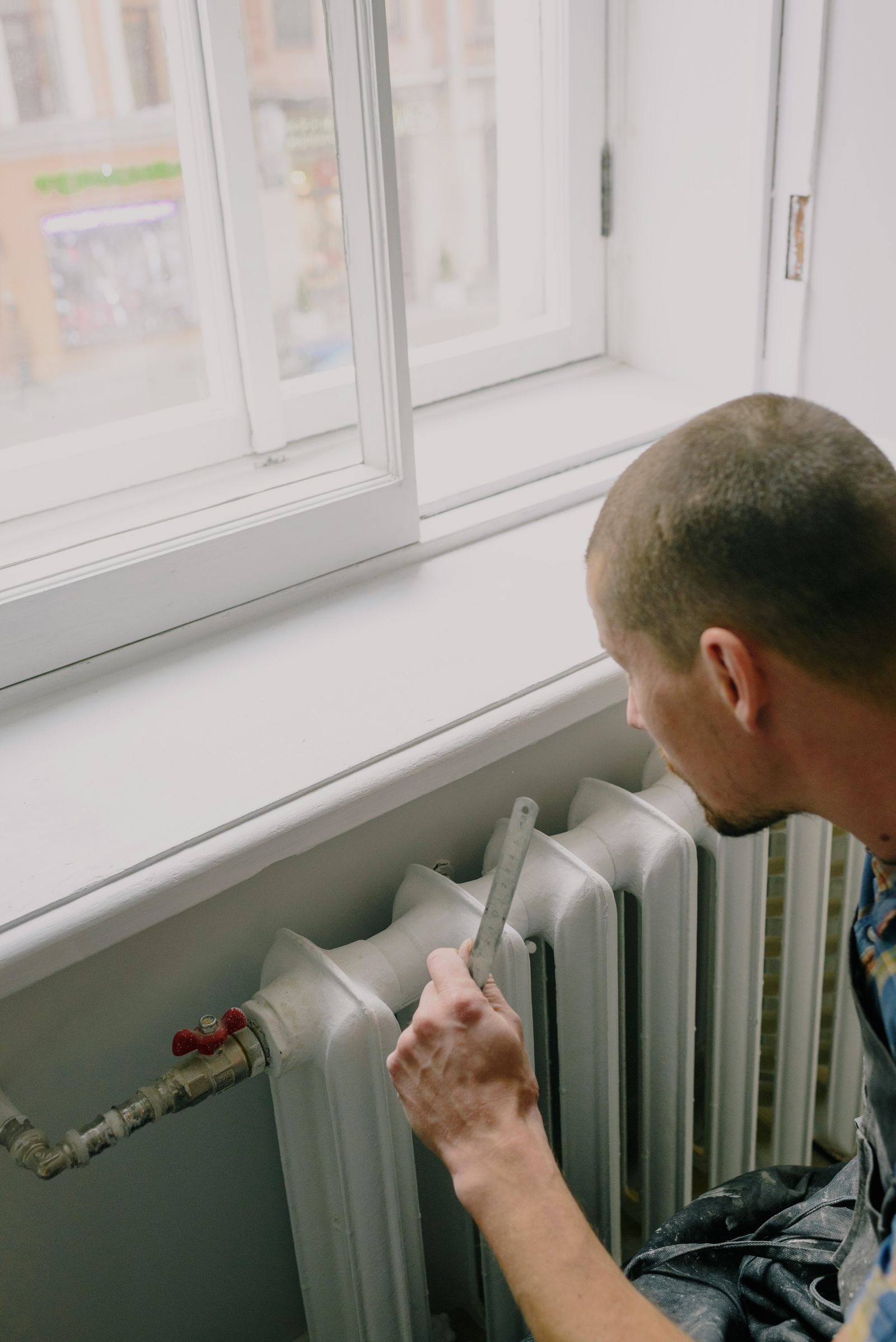 Engineer working on a domestic radiator